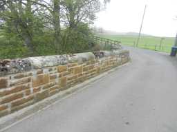 Oblique view of stonework on left face at the end of West Blackdene Bridge over River Wear, Stanhope April 2016